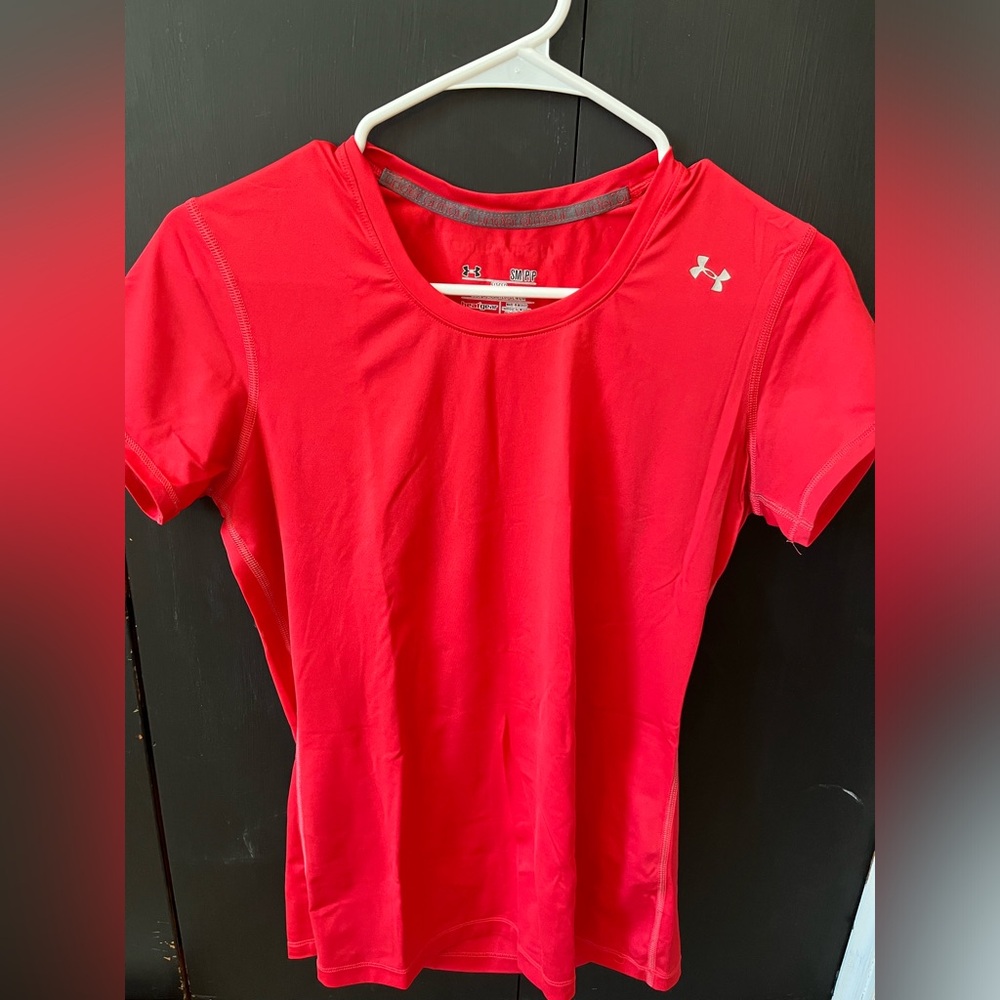 Pink under armour shirt.